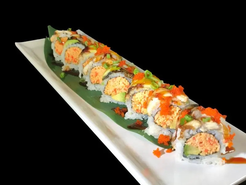 Eel topped sushi roll with tobiko, green onion and sauces at Shoku Sushi & Bar, a Japanese Restaurant in Monroe