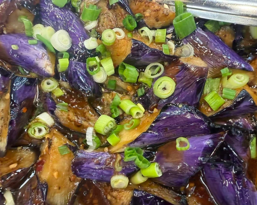 Braised eggplant with savory sauce and green onions at Siu Lap City, a Chinese Restaurant in Houston