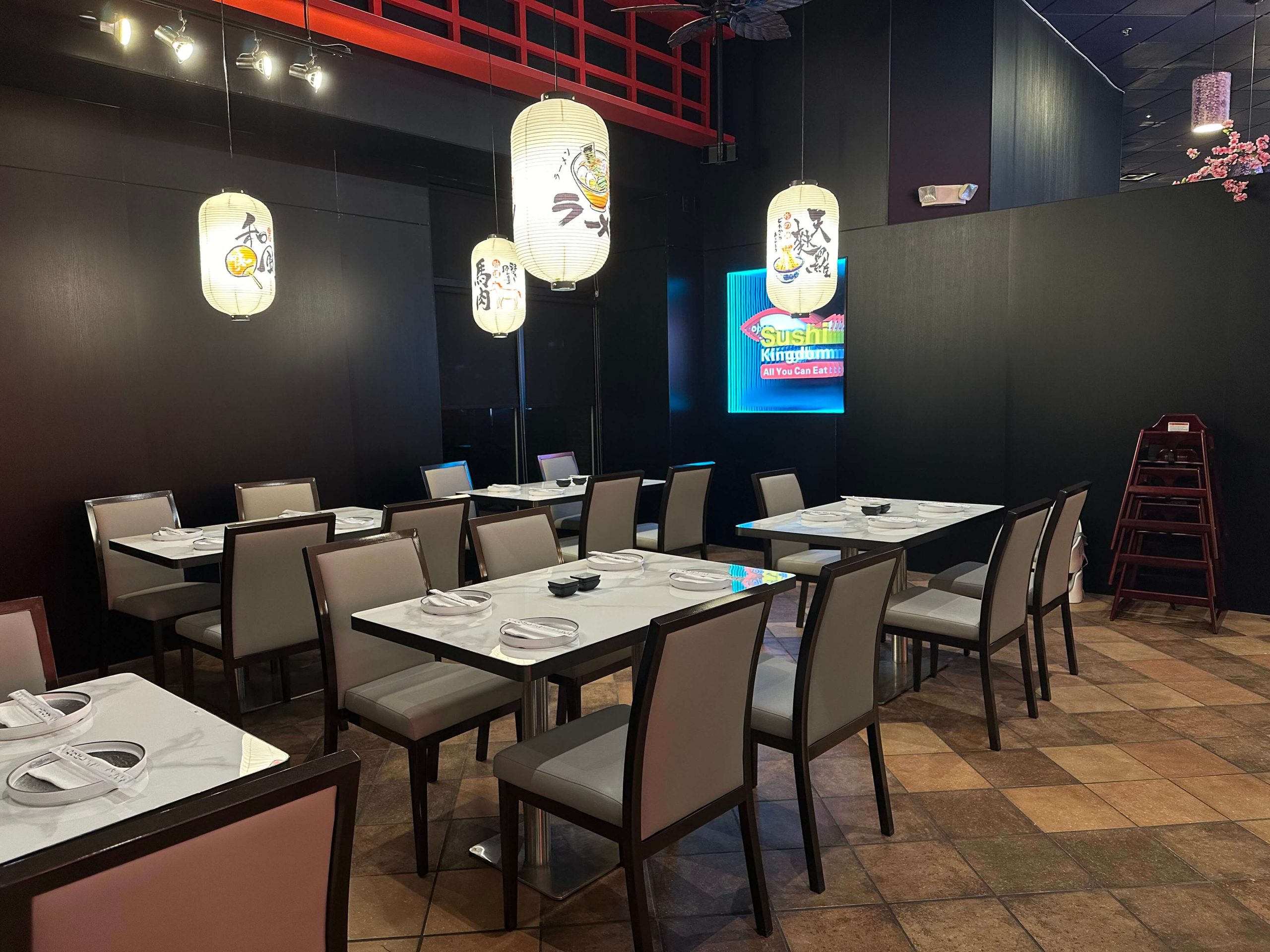 Sushi-Kingdom-Japanese-Restaurant-Sushi-Bar-Area-Savannah Cozy dining area with dark walls and Japanese - themed lanterns at Sushi Kingdom, a Japanese Restaurant in Savannah