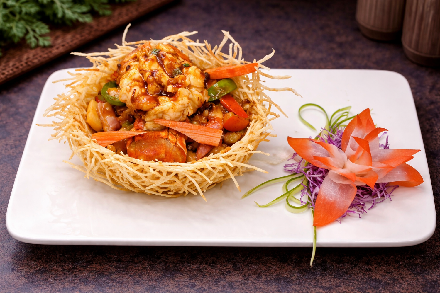 Stir-fried lobster in a crispy potato nest with vegetable garnish