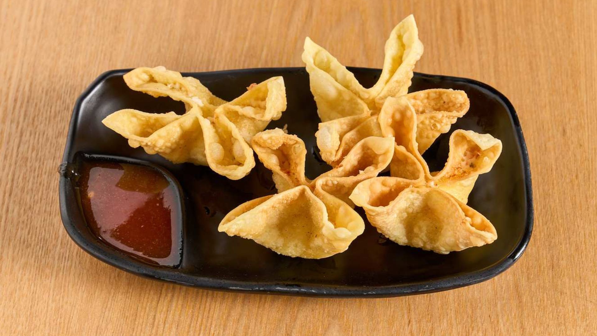 Crispy fried cream wontons with sweet dipping sauce at Spice House, a Chinese Restaurant in Plano