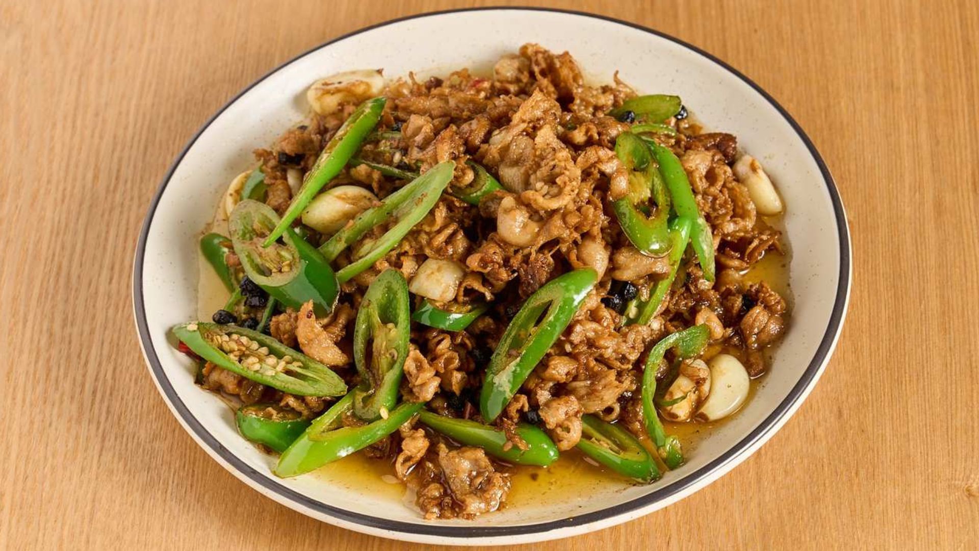 Sautéed pork slices with green chili peppers at Spice House, a Chinese Restaurant in Plano