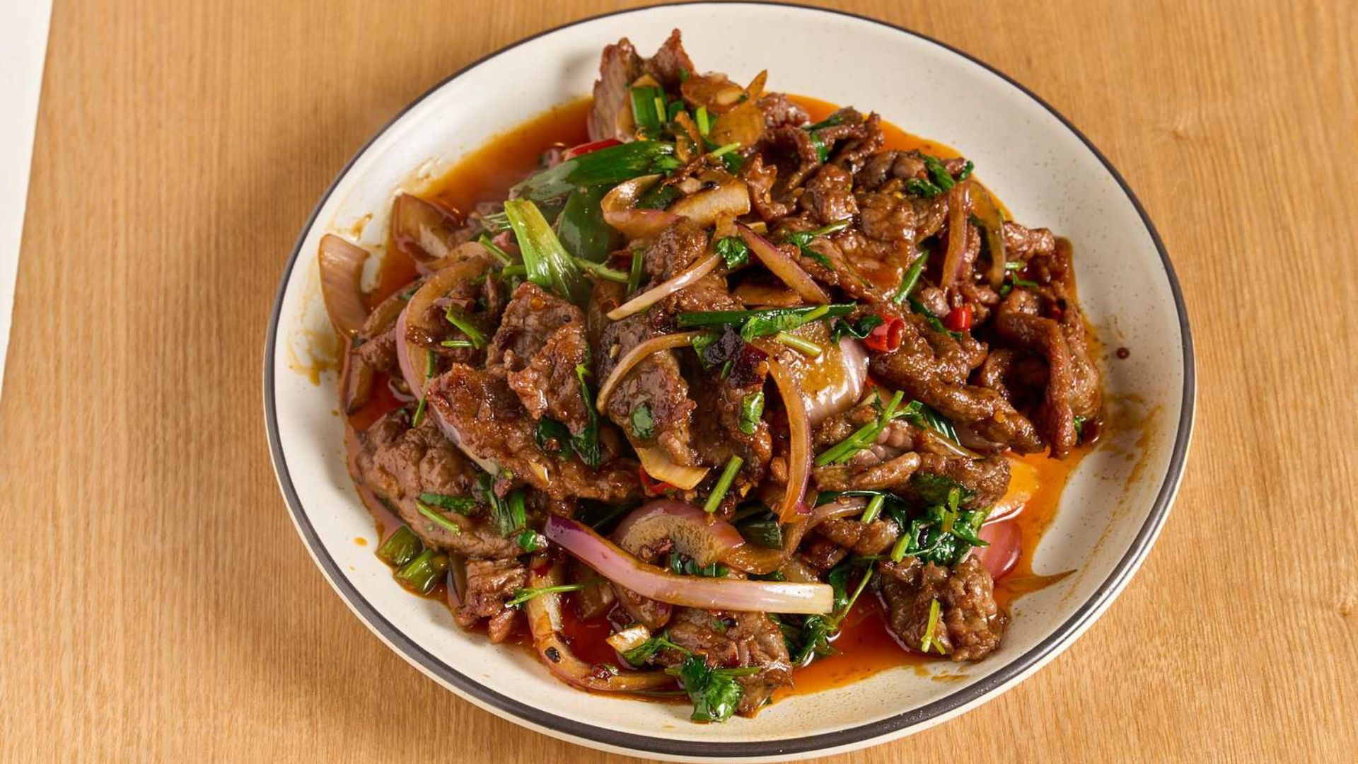Stir-fried beef with red onion and coriander at Spice House, a Chinese Restaurant in Plano