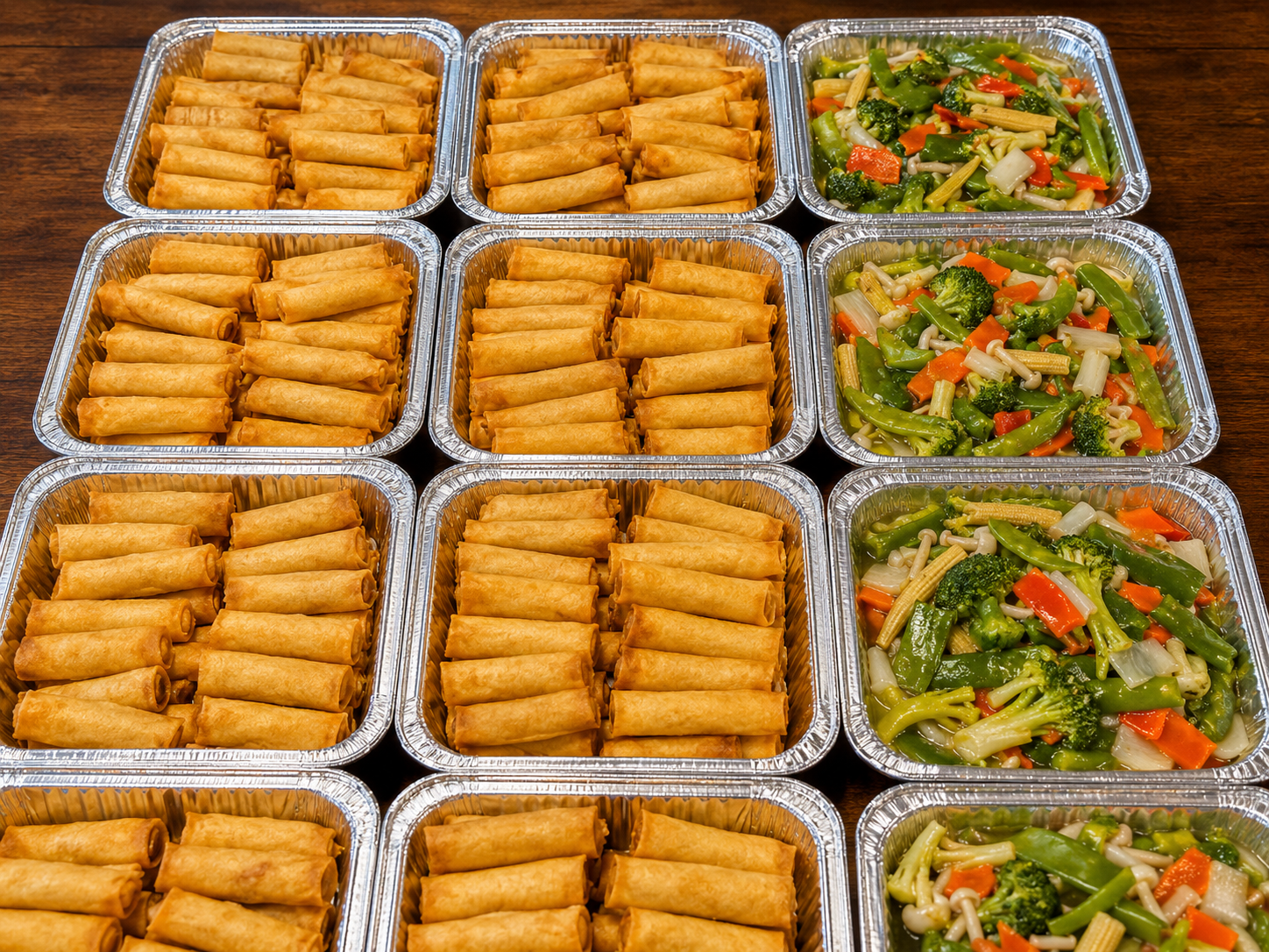Catering trays of spring rolls and vegetables at Spicy Girl, a Sichuan Restaurant in Houston