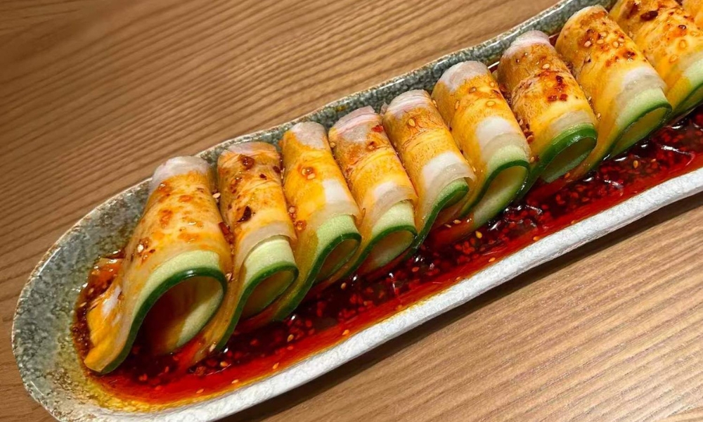 Cucumber rolls drizzled with spicy chili oil and sesame seeds at Spicy Home 那家川菜，a Chinese Restaurant in Hacienda Heights