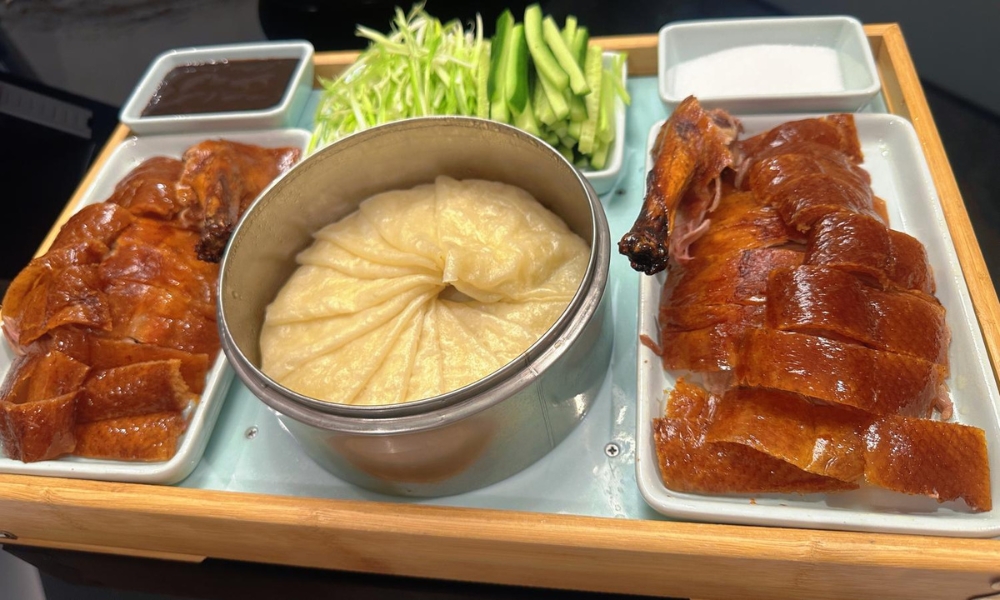 Crispy Peking duck served with pancakes, scallions, cucumber, and hoisin sauce at Spicy Home 那家川菜，a Chinese Restaurant in Hacienda Heights