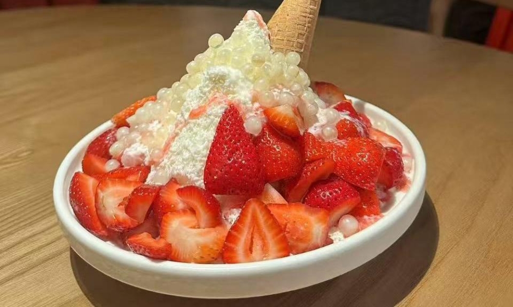 Shaved ice with fresh strawberries, tapioca pearls, and an ice cream cone at Spicy Home 那家川菜，a Chinese Restaurant in Hacienda Heights