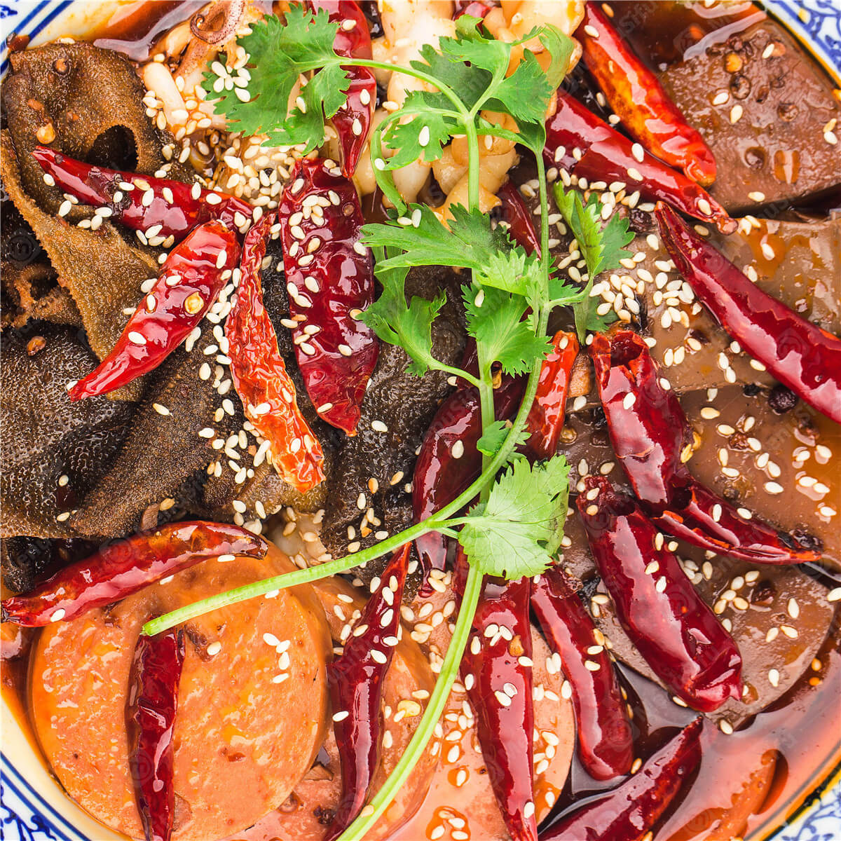 A spicy dish with duck blood, tripe, sausages, chili peppers, and sesame at Spicy Hunan 湘菜小厨, a Chinese restaurant in Houston