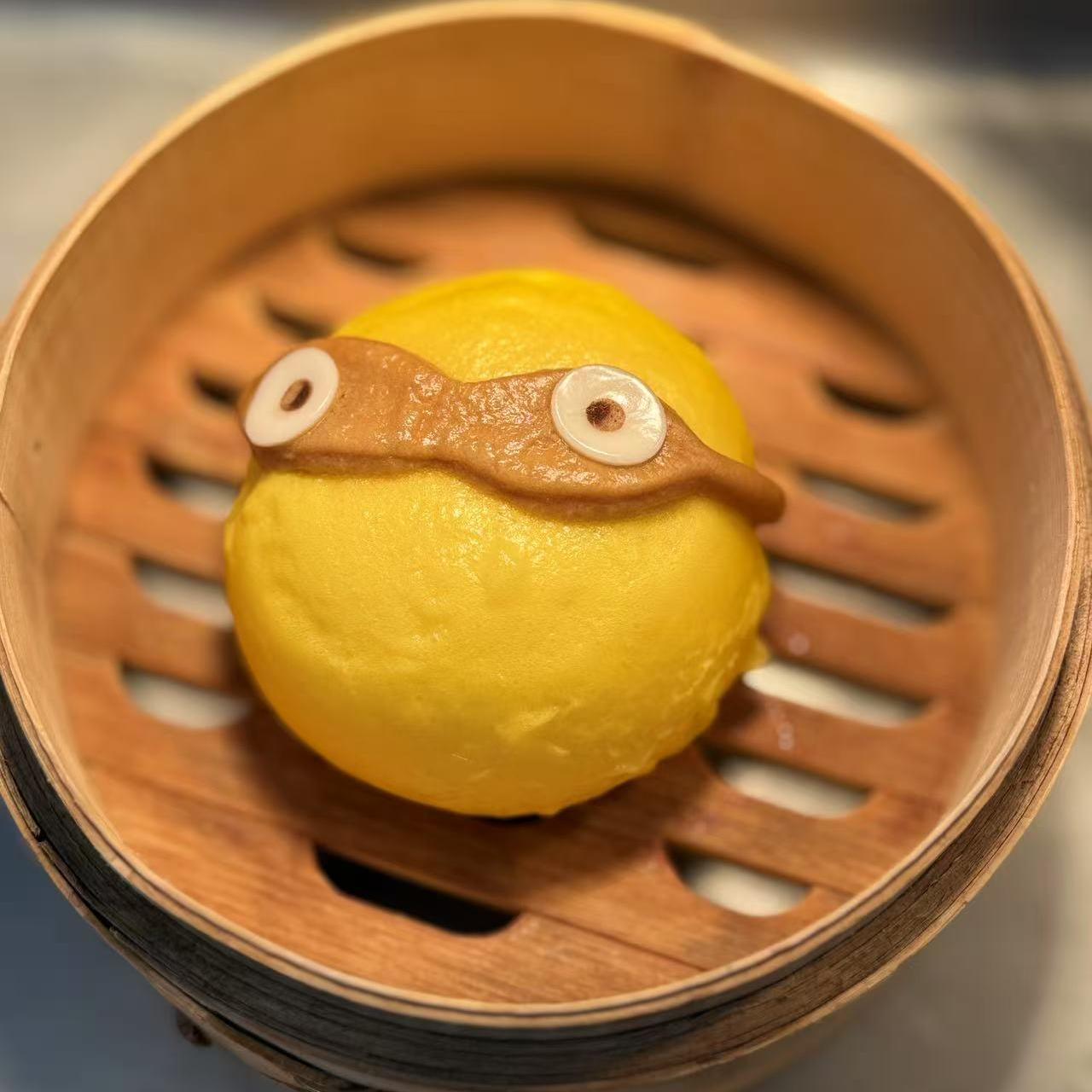 Red Bean Bun - Yellow steamed bun with sweet red bean paste filling, cute character design at Starbelly Asian Kitchen, a Asian Fusion Restaurant in Montclair