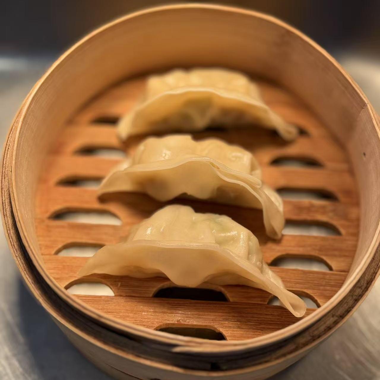 Pork Chicken Dumplings - Steamed dumplings filled with mixed pork and chicken, savory flavor at Starbelly Asian Kitchen, a Asian Fusion Restaurant in Montclair