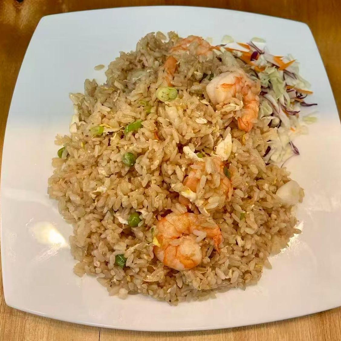 Shrimp fried rice served with a side of shredded cabbage at Starbelly Asian Kitchen, a Asian Fusion Restaurant in Montclair