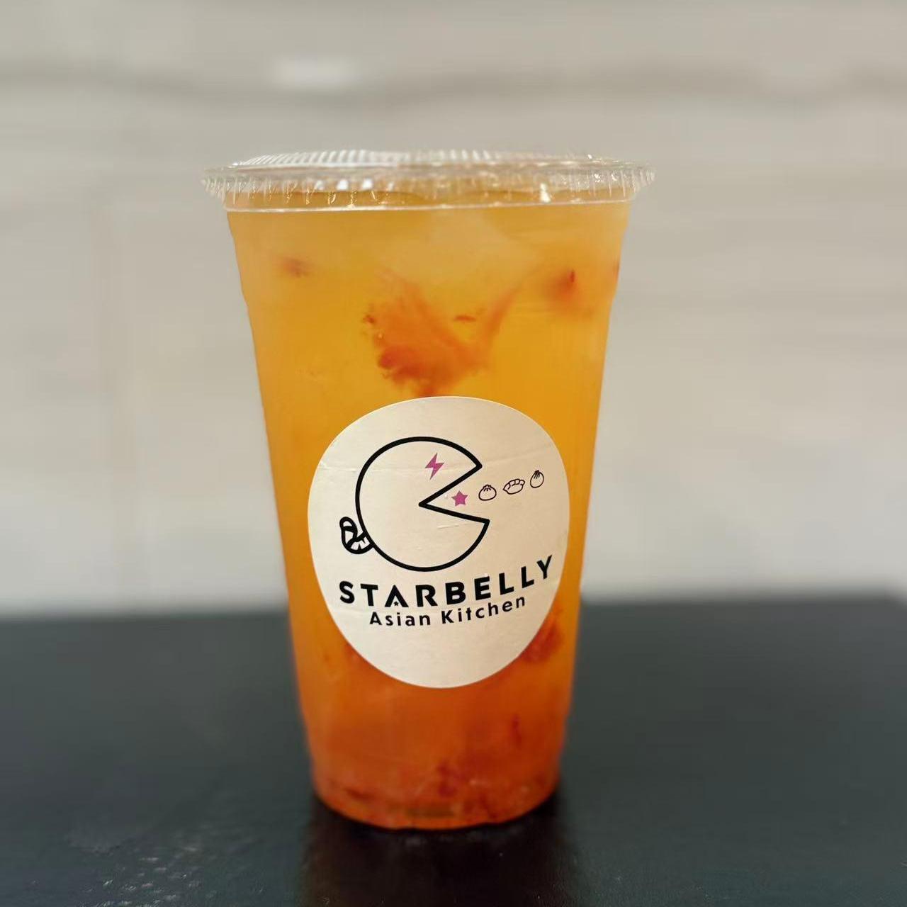 Passion fruit green tea in a plastic cup at Starbelly Asian Kitchen, a Asian Fusion Restaurant in Montclair