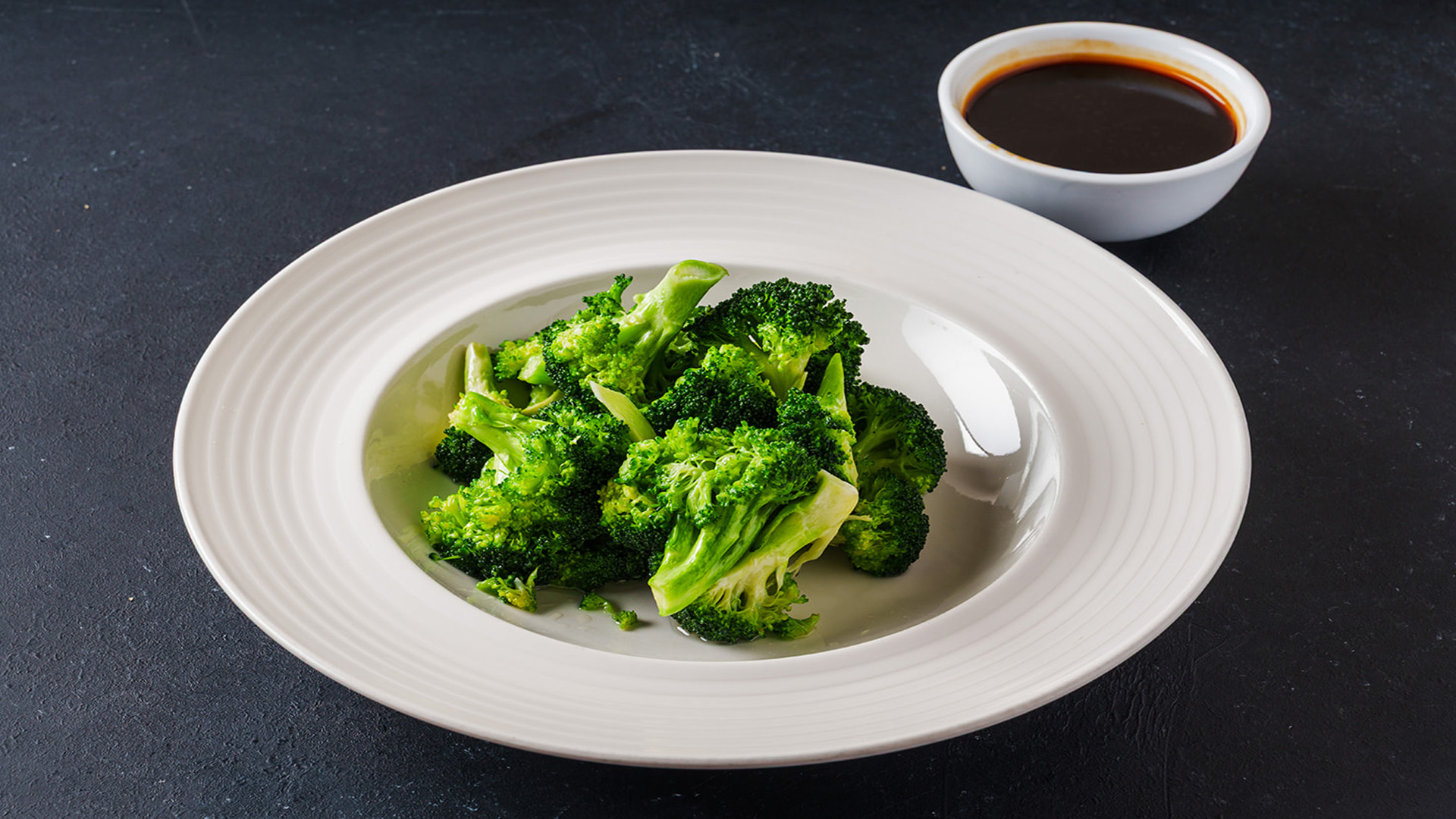 Fresh steamed broccoli with sauce at STAR KTV, a Asian Fusion Restaurant in Midwest City
