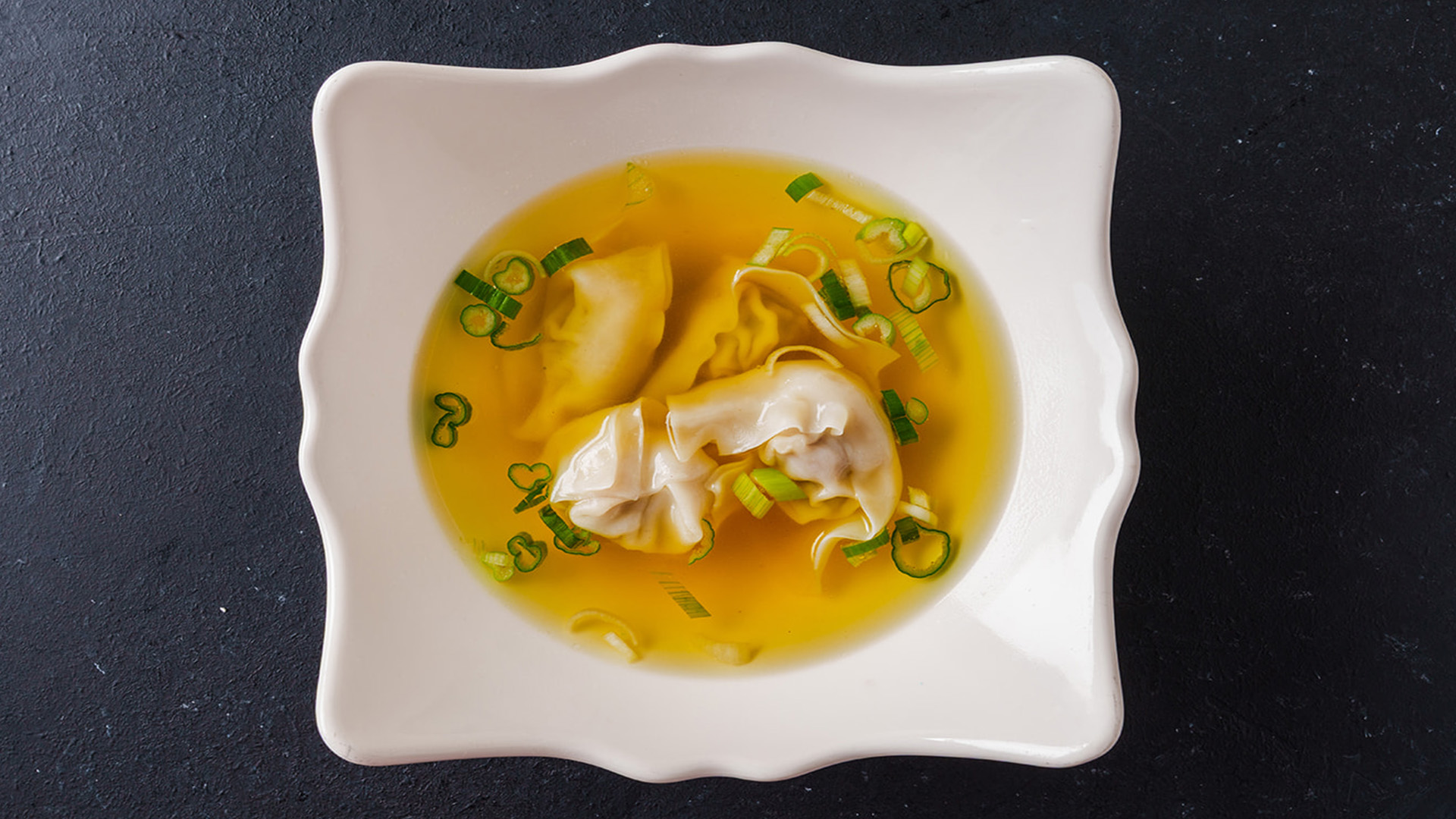 Warm wonton soup with scallions at STAR KTV, a Asian Fusion Restaurant in Midwest City