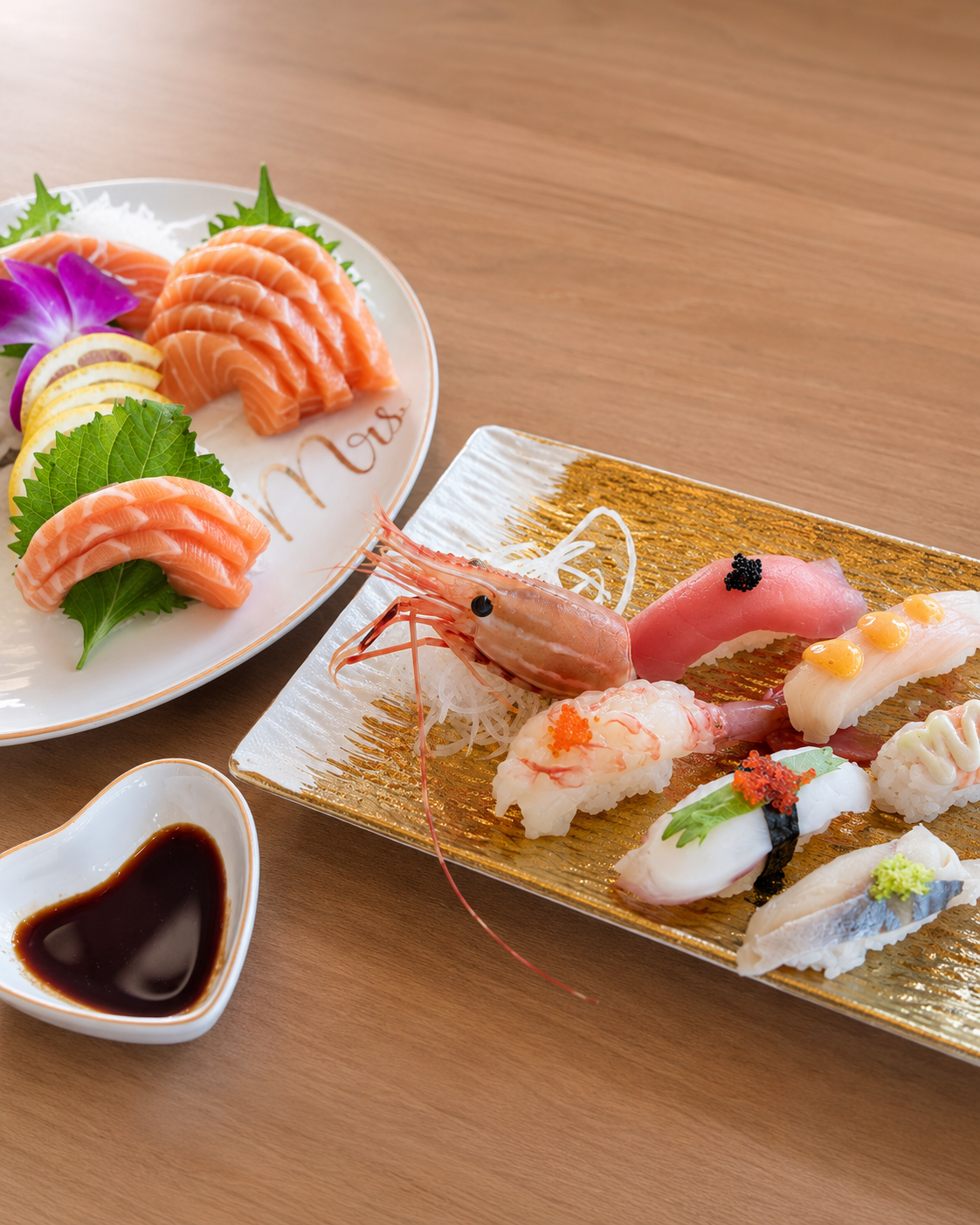 Assorted nigiri with salmon sashimi and soy sauce at Sucré d’Amour Café & Sushi, a Sushi Restaurant in Fremont