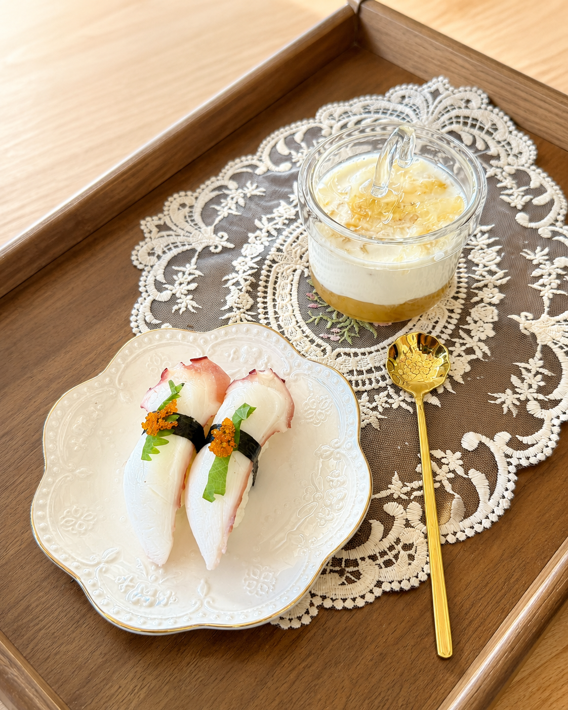 Two octopus nigiri with a creamy dessert cup at Sucré d’Amour Café & Sushi, a Sushi Restaurant in Fremont