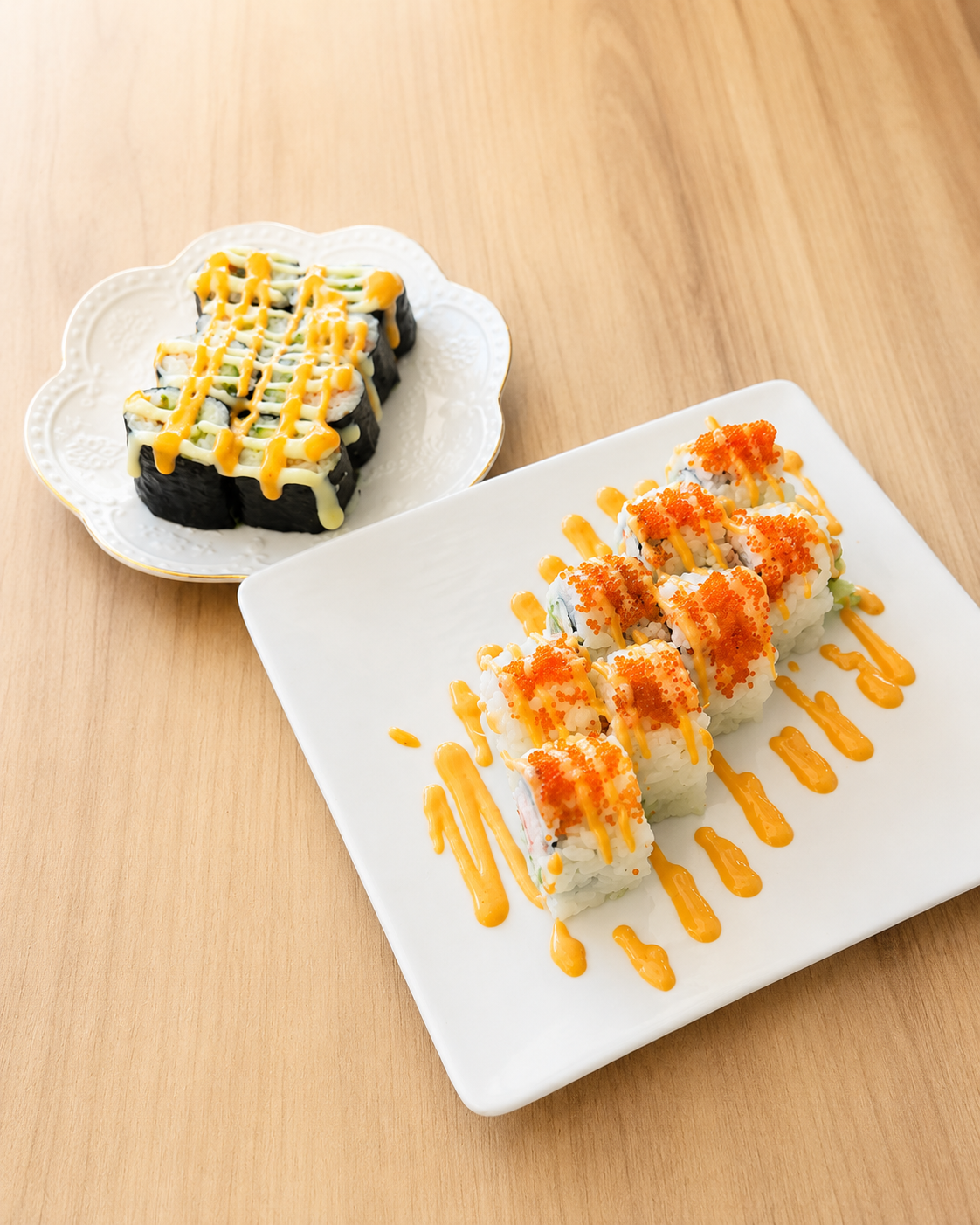 Sushi rolls with orange sauce and fish roe at Sucré d’Amour Café & Sushi, a Sushi Restaurant in Fremont