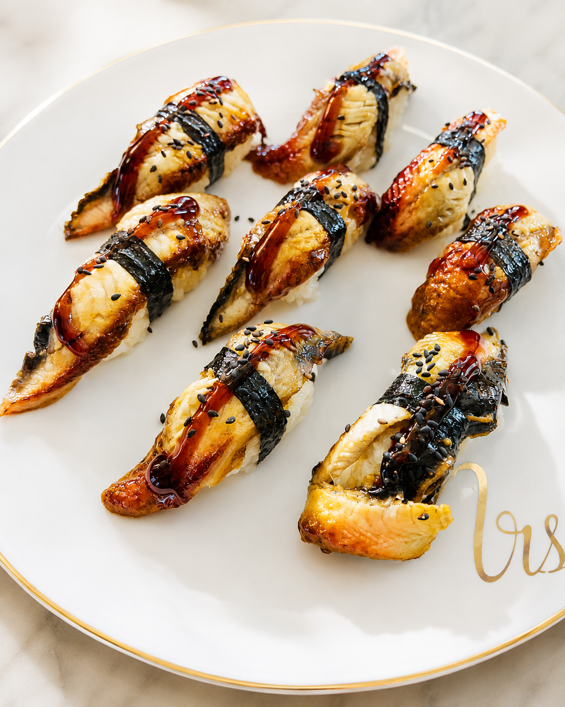 Glazed eel nigiri with sesame seeds at Sucré d’Amour Café & Sushi, a Sushi Restaurant in Fremont