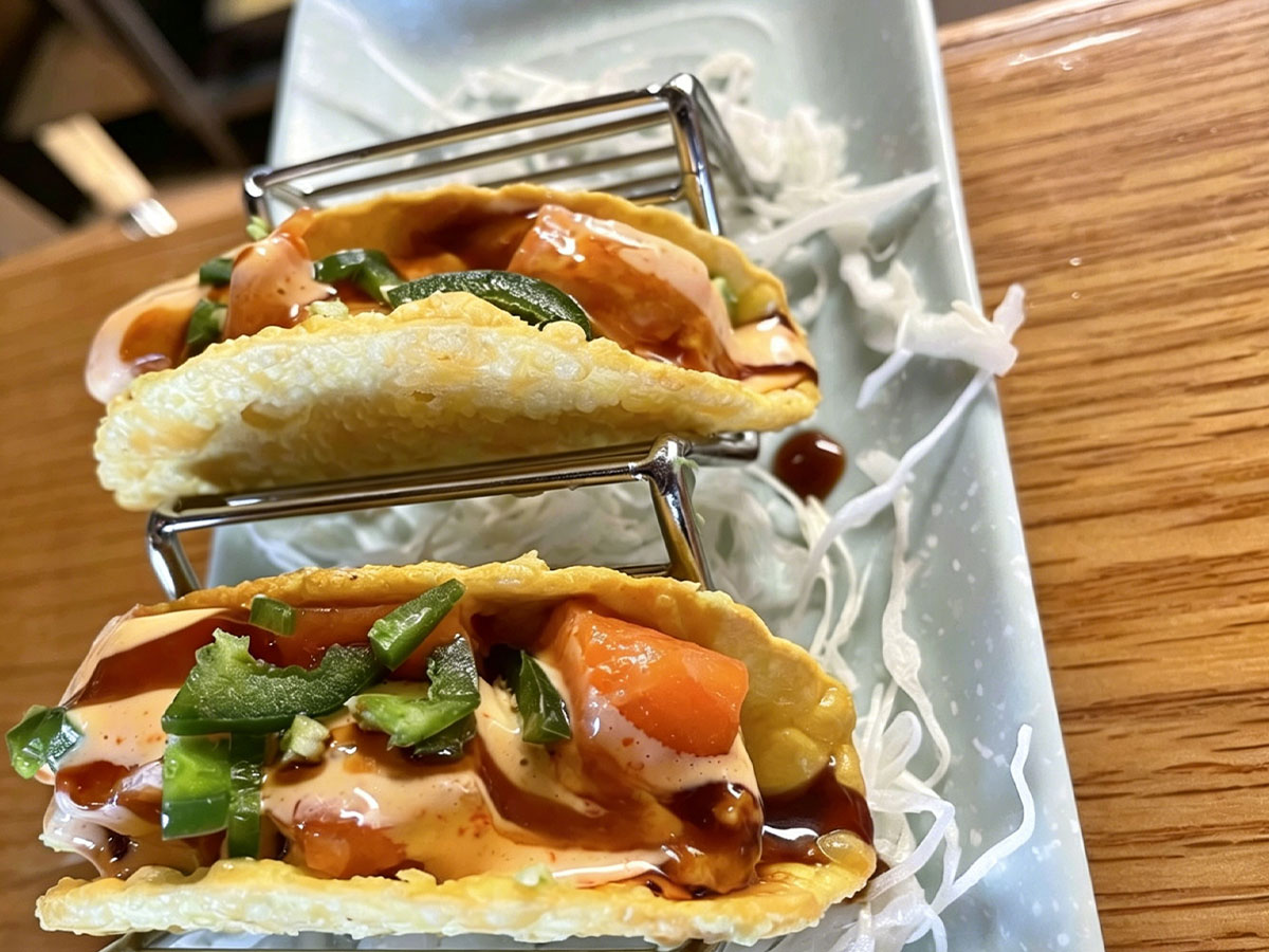 Crispy salmon Japanese tacos with jalapeño, spicy mayo, and shredded radish garnish