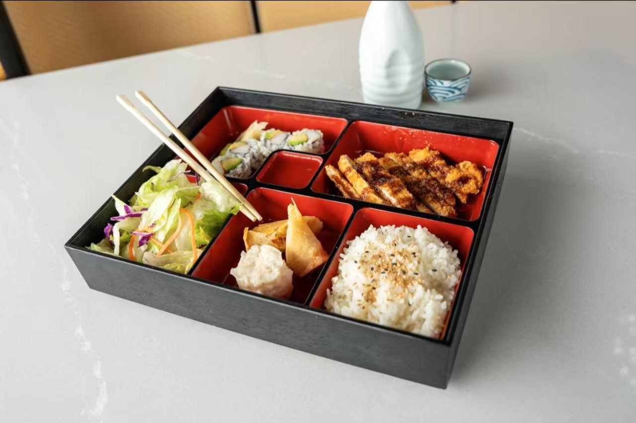 Bento with rice,sushi,meat, salad at Surf To Turf,a Seafood restaurant in Grand Junction.
