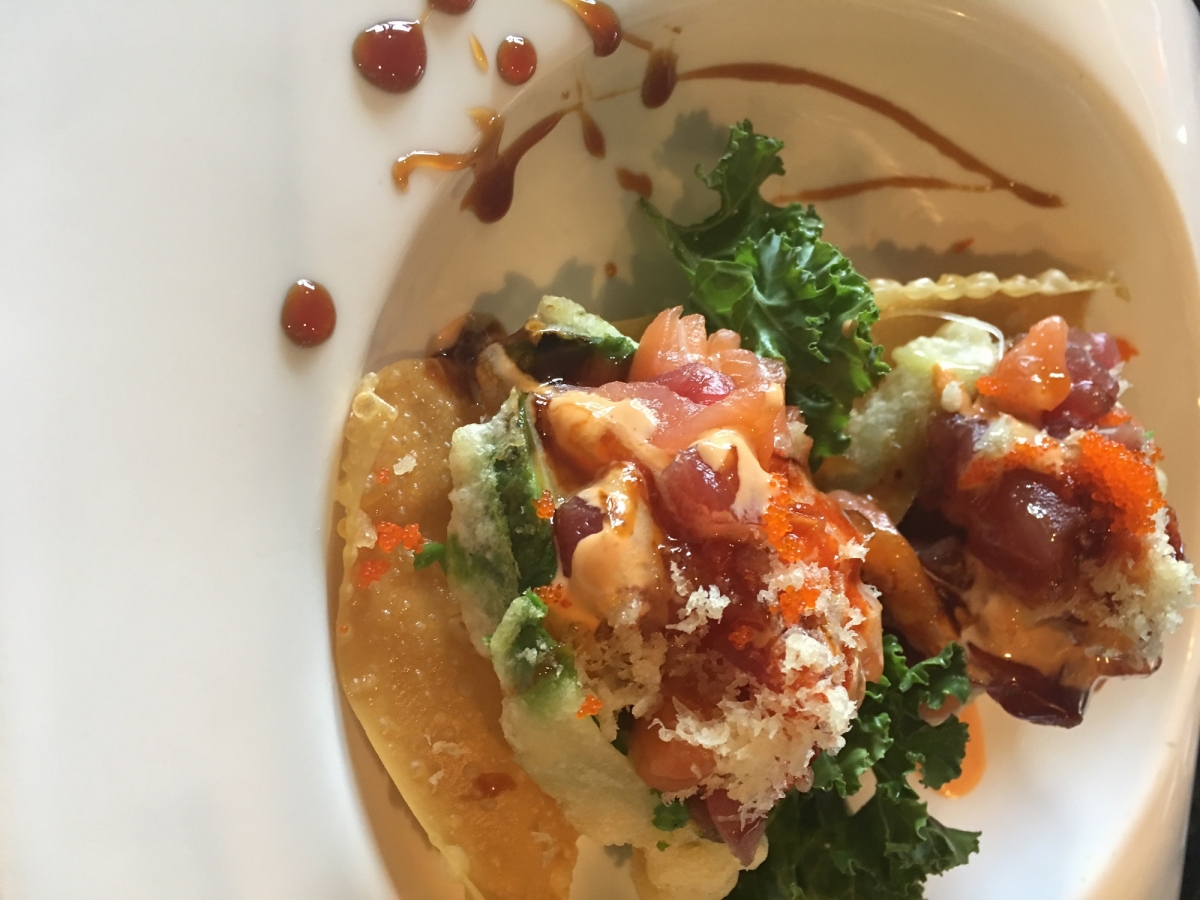 Crispy sushi tacos topped with raw tuna, roe and spicy sauce garnished with kale at Sakura house, a Japanese Restaurant in Willow Grove