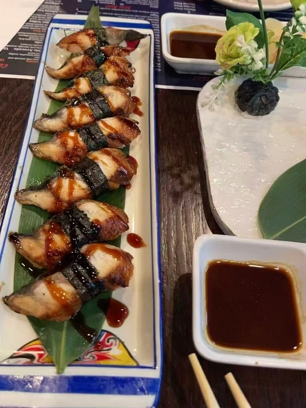 Sushi-King-&-Grill-Japanese-Restaurant-Eel-Sushi-Corona Grilled eel sushi with savory sauce at Sushi King & Grill, a Japanese Restaurant in Corona.