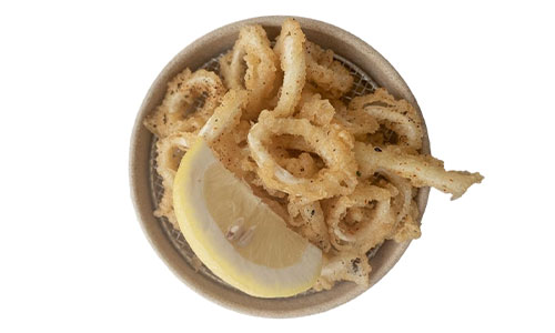 Top-down view of golden seasoned fried calamari on mesh tray, garnished with lemon slice, plain white background.