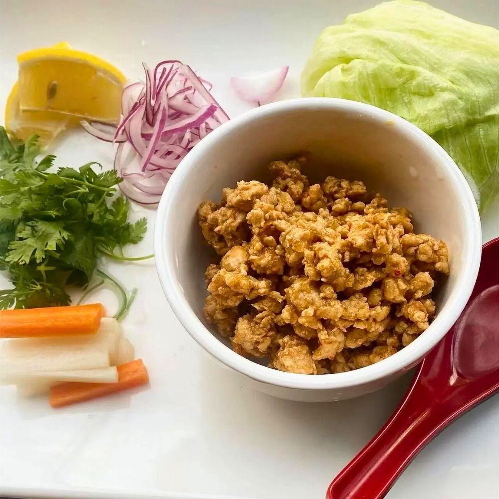 Savory spicy ground chicken served with fresh lettuce and veggies at Sushi of Miso, a Japanese Restaurant in Long Island City.