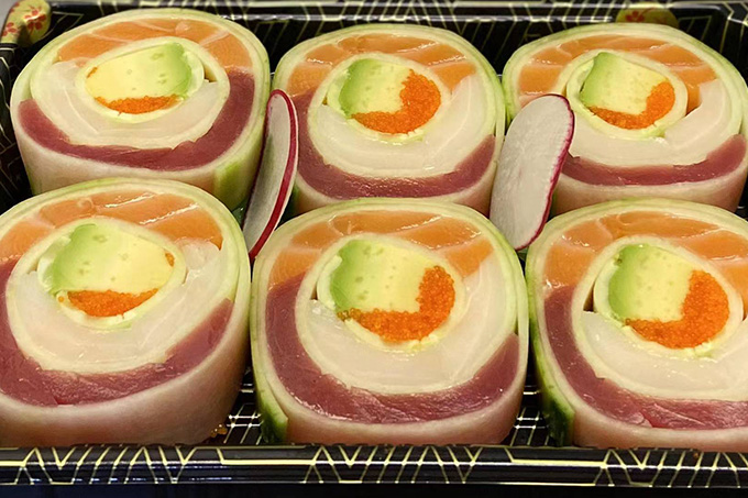 Sushi rolls filled with avocado and other ingredients, neatly arranged in a tray at SUSHI YA，a Japanese Restaurant in Philadelphia