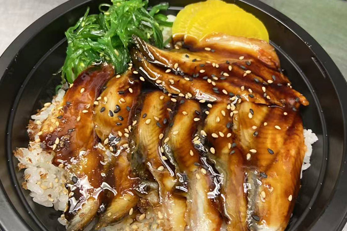 A bowl of unagi donburi, with grilled eel and sauce over rice at SUSHI YA，a Japanese Restaurant in Philadelphia