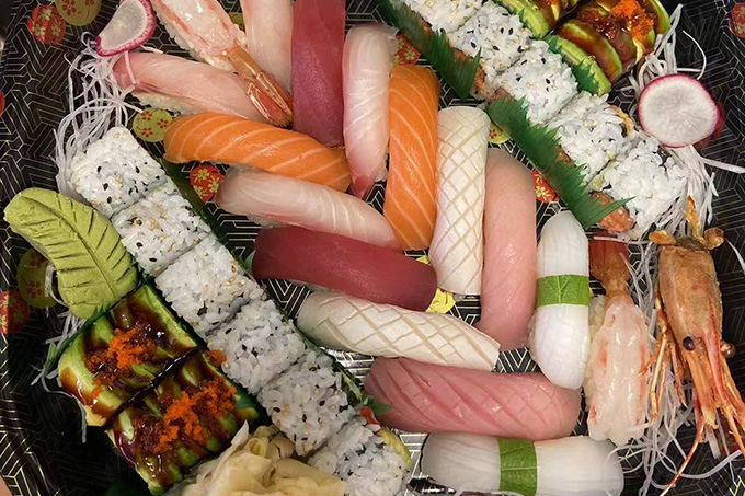 An assorted sushi platter with various types of sushi, including rolls and nigiri at SUSHI YA，a Japanese Restaurant in Philadelphia