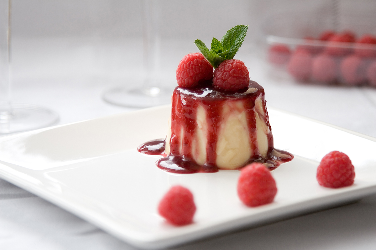 Raspberry panna cotta with berry sauce at Sweet Mousse, a Dessert shop in Philadelphia