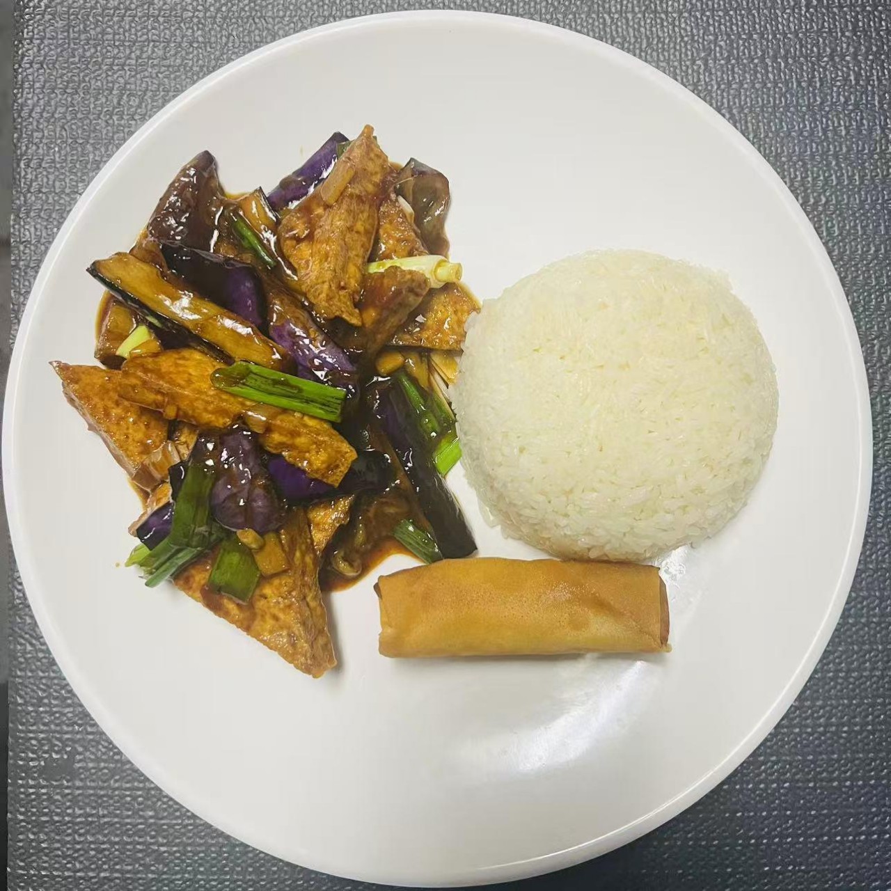 Lunch combo with eggplant, tofu, rice and egg roll at Szechuan Impression, a Chinese Restaurant in Federal Way