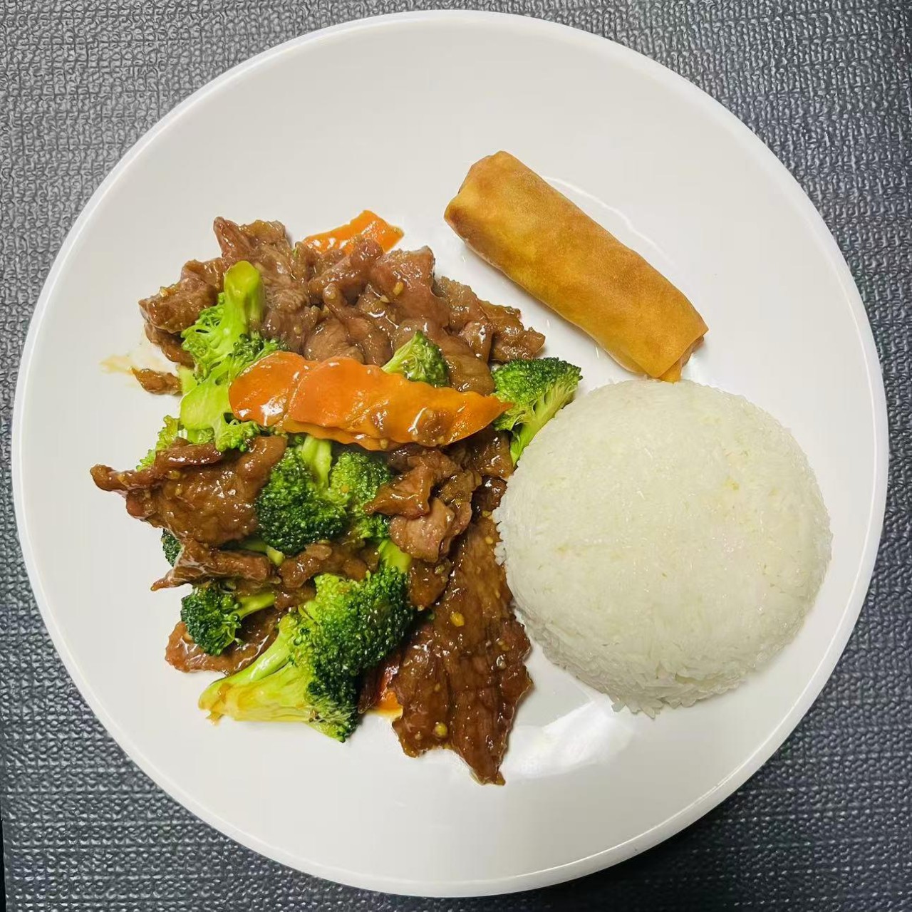 Lunch combo with kale beef and egg roll at Szechuan Impression, a Chinese Restaurant in Federal Way