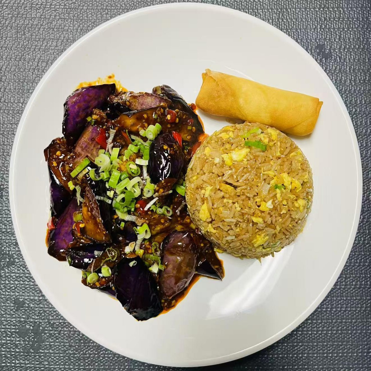 Lunch combo with Yuxiang eggplant, fried rice and egg roll at Szechuan Impression, a Chinese Restaurant in Federal Way