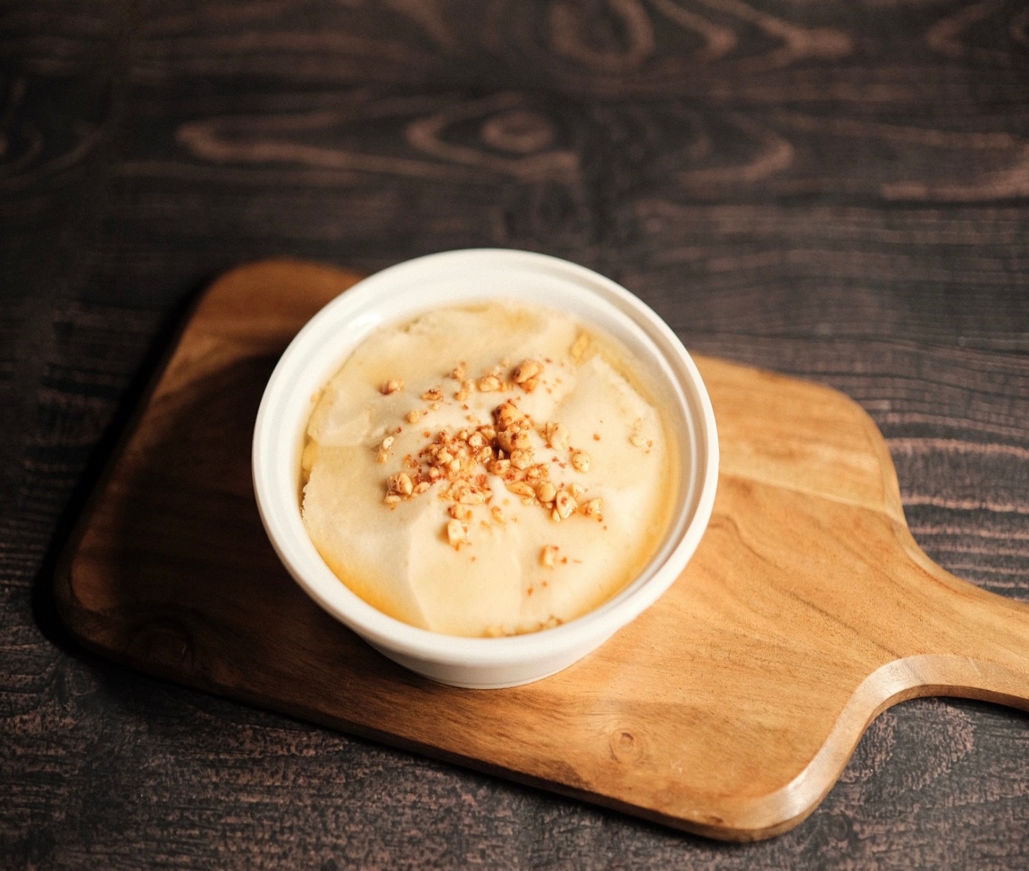 Szechuan-Kitchen-Chinese-Restaurant-Brown-Sugar-Tofu-Pudding-Las-Vegas Silky tofu pudding with brown sugar and crushed nuts.