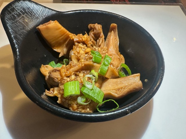 Braised Pork Tripe - Flavorful braised pork tripe garnished with garlic and scallions at T-Pot & BBQ, a Asian Fusion Restaurant in College Park