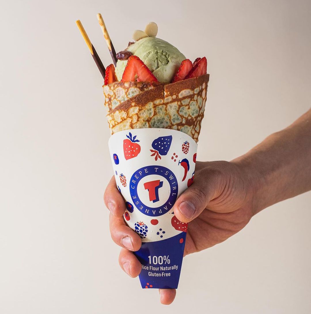 Hand - held crepe cone with strawberries, matcha ice cream at T-Swirl Crêpe，a Japanese Crêperie & Bubble Tea Shop in Phoenixville