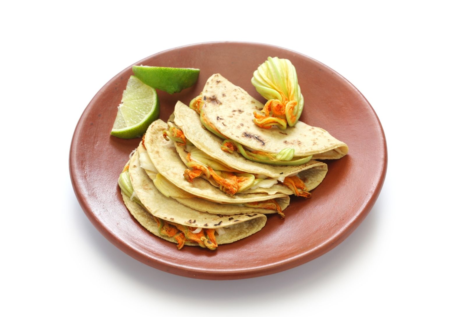 Squash blossom quesadillas with lime wedges at Taco Vida, a Mexican Restaurant in New York
