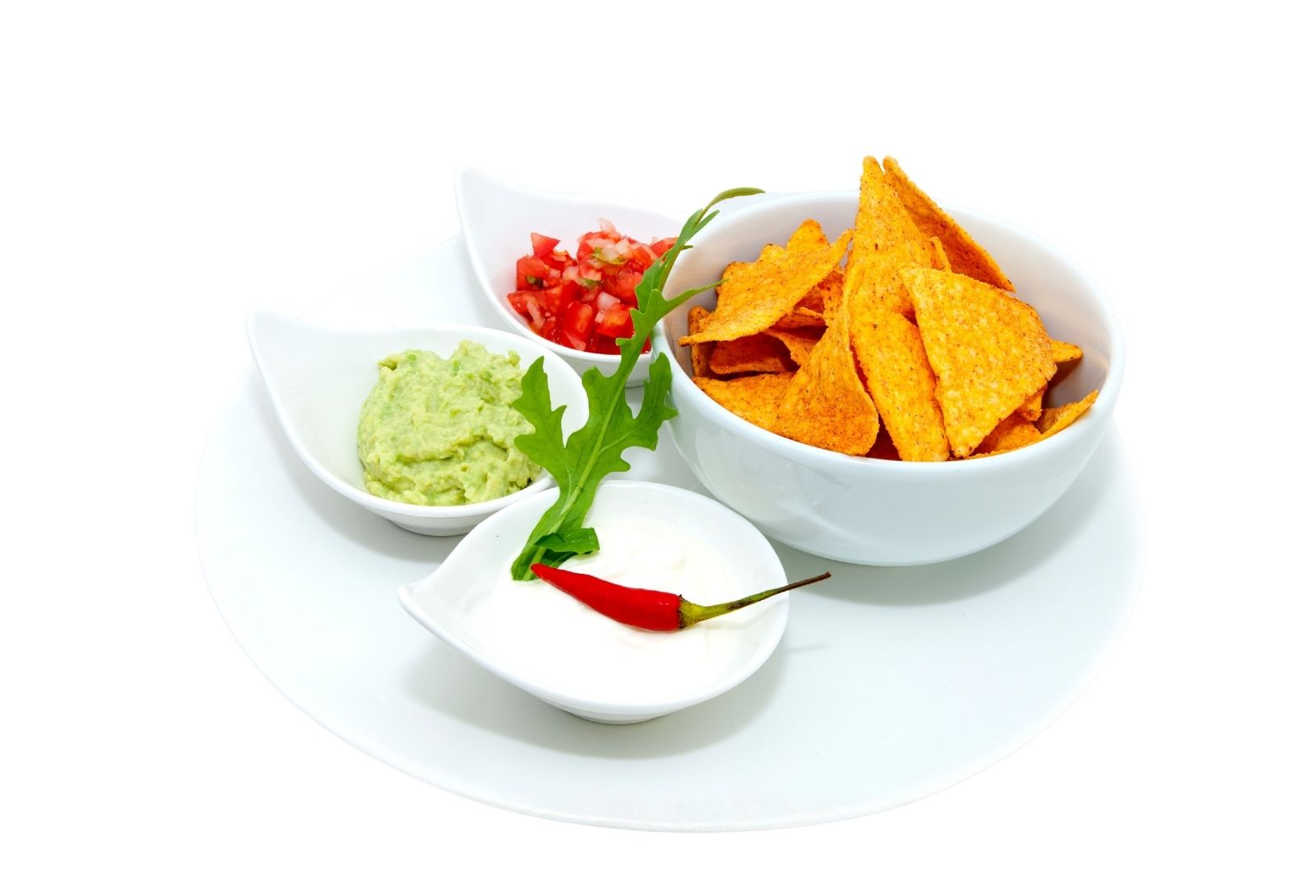 Tortilla chips with guacamole, salsa and sour cream at Taco Vida, a Mexican Restaurant in New York