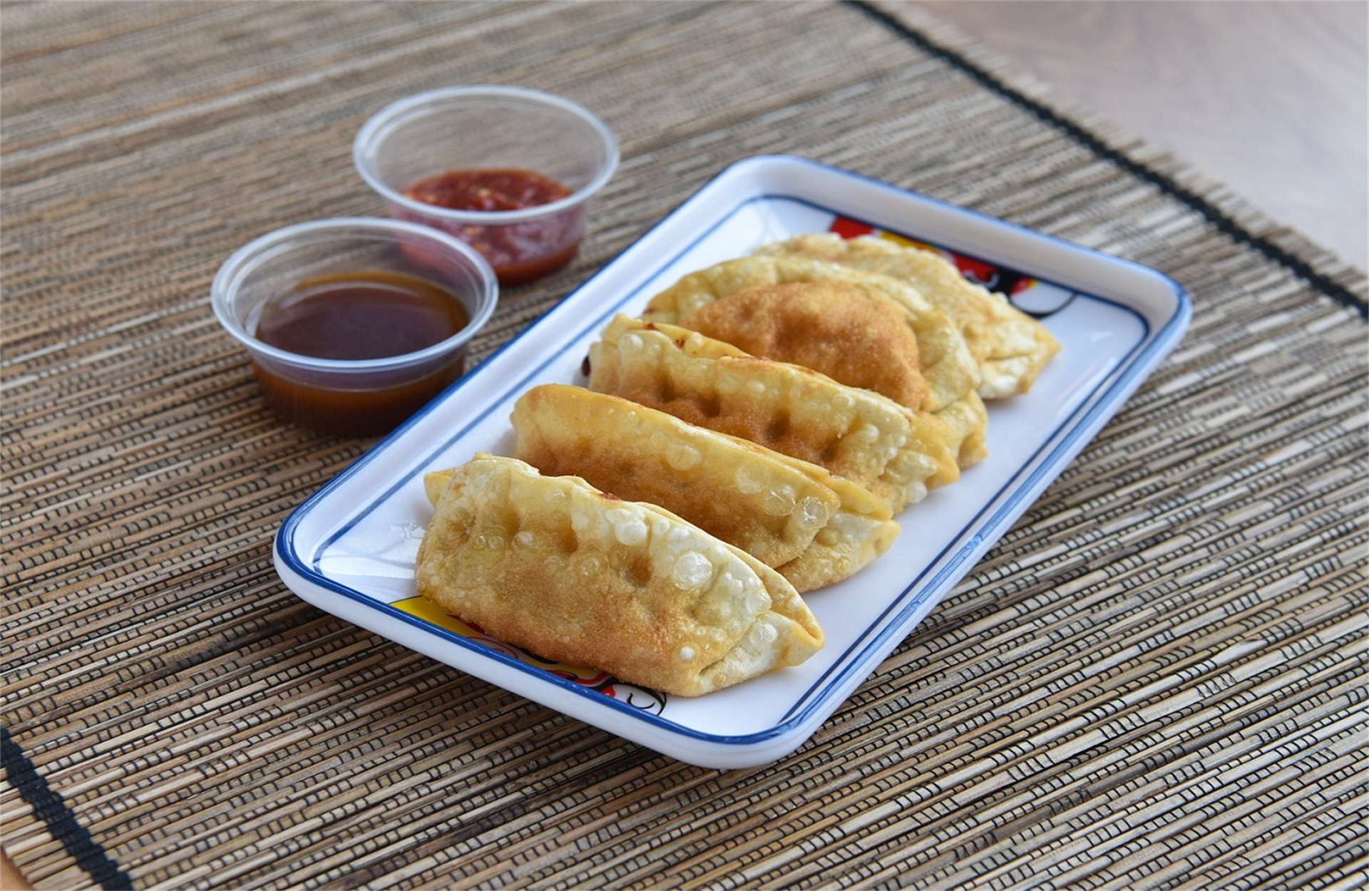Crispy fried dumpling, served with two dipping sauces.
