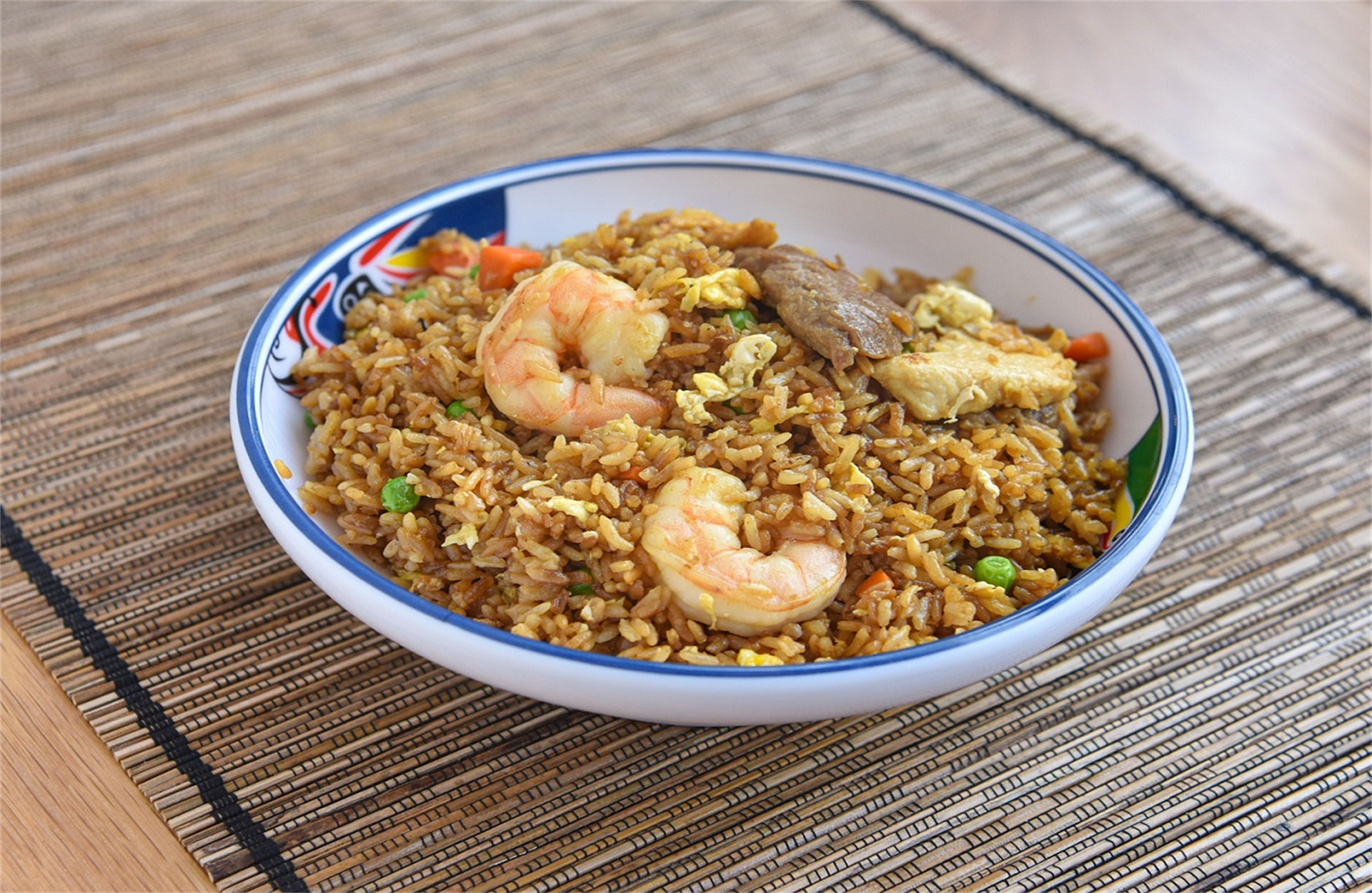Fried rice with shrimp, beef, eggs and veggies.