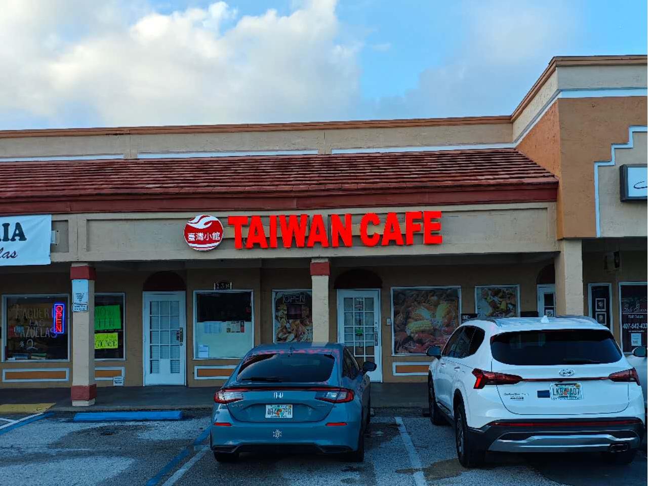Taiwan-Cafe-Chinese-Restaurant-Exterior-Winter-Springs Exterior view of Taiwan Cafe with red sign and parked cars at Taiwan Cafe, a Chinese Restaurant in Winter Springs