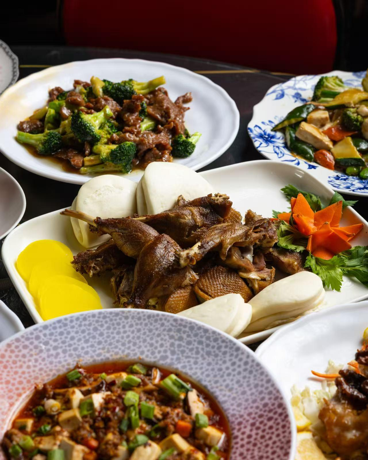 A table filled with various classic Chinese dishes