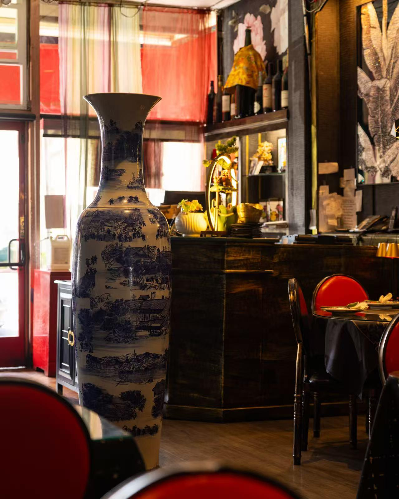 Restaurant interior with a large blue and white porcelain vase