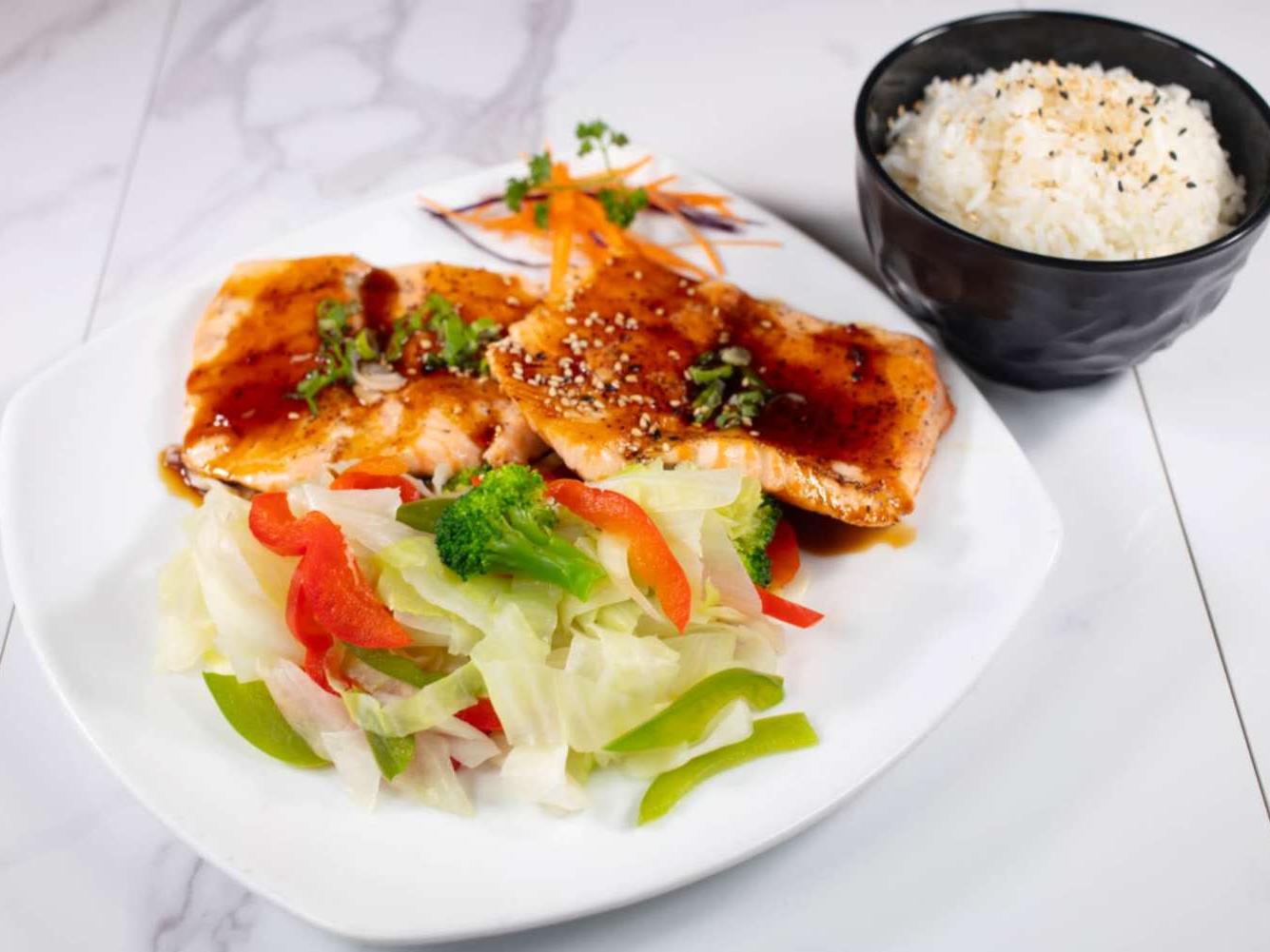 Glazed grilled salmon served with stir-fry veggies & sesame rice at Taki Sushi, a Japanese Restaurant in Toronto
