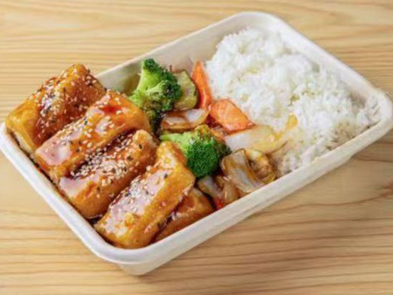 Disposable takeout box with glazed sesame tofu, broccoli, mixed veggies and a side of white steamed rice at Takuma Hibachi , a Japanese Restaurant in Hillsboro