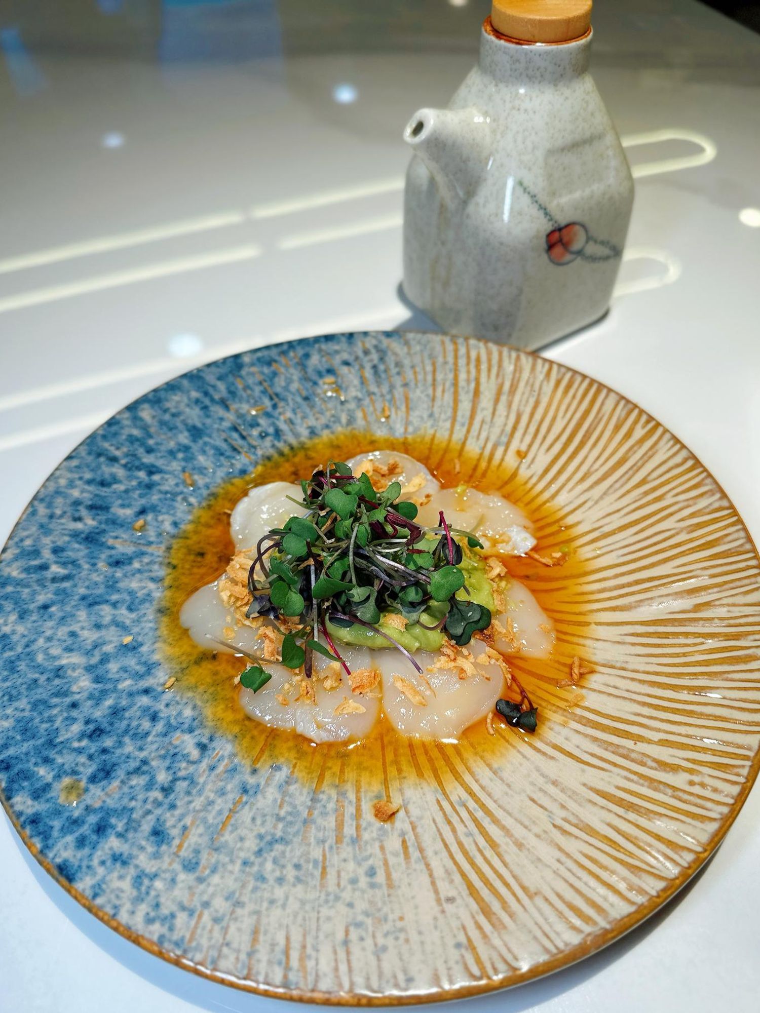 Scallop carpaccio with citrus sauce at Takumi Sushi A.Y.C.E, a Japanese Restaurant in Columbus