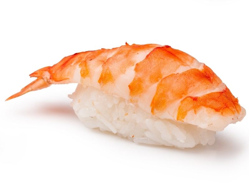 Cooked shrimp nigiri sushi with intact shrimp tail at Takumi Sushi, a Sushi Restaurant in Seattle
