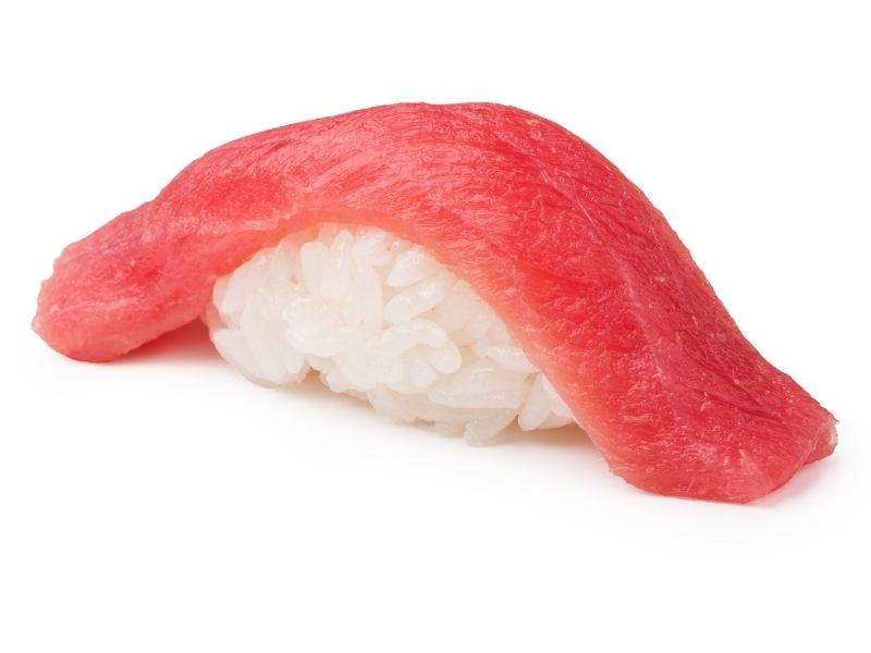 Lean tuna nigiri sushi laid over sticky sushi rice at Takumi Sushi, a Sushi Restaurant in Seattle